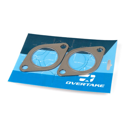 Two gaskets on a blue Overtake branded paper background